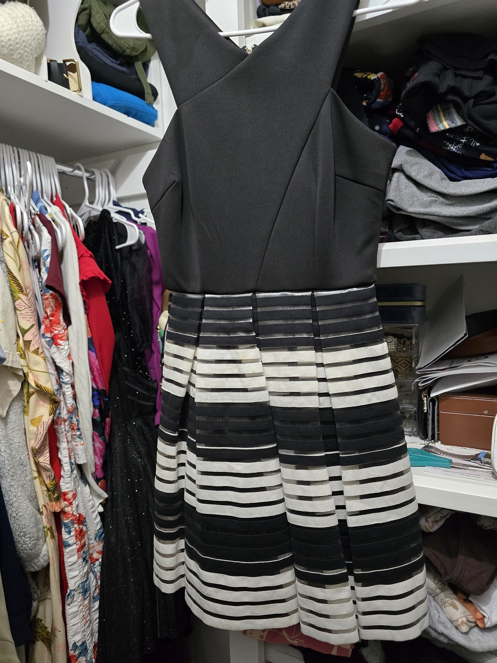 Sleeveless Black Dress with Black-and-White Striped Skirt